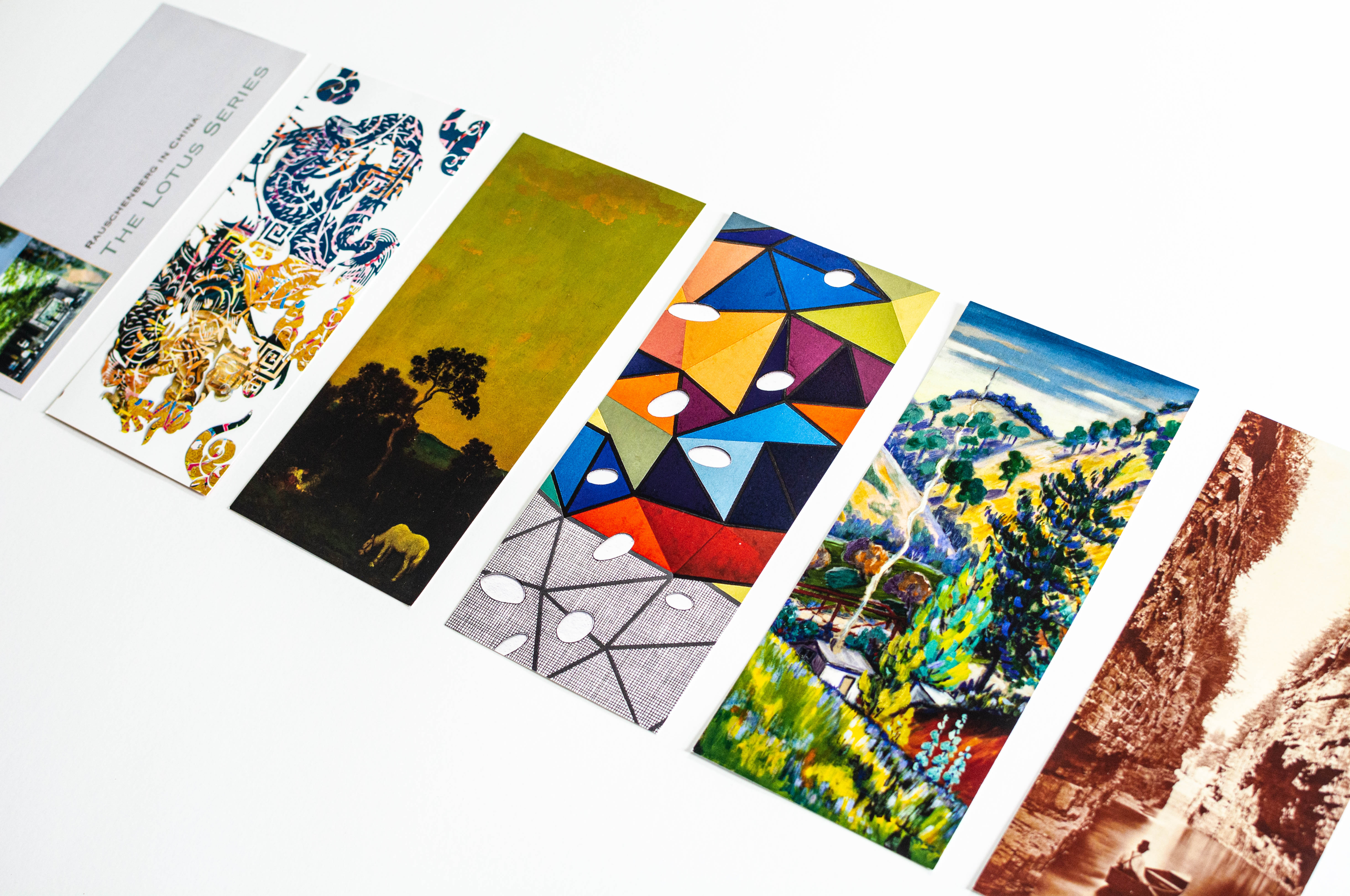 Card fronts feature artwork relevant to each exhibition.