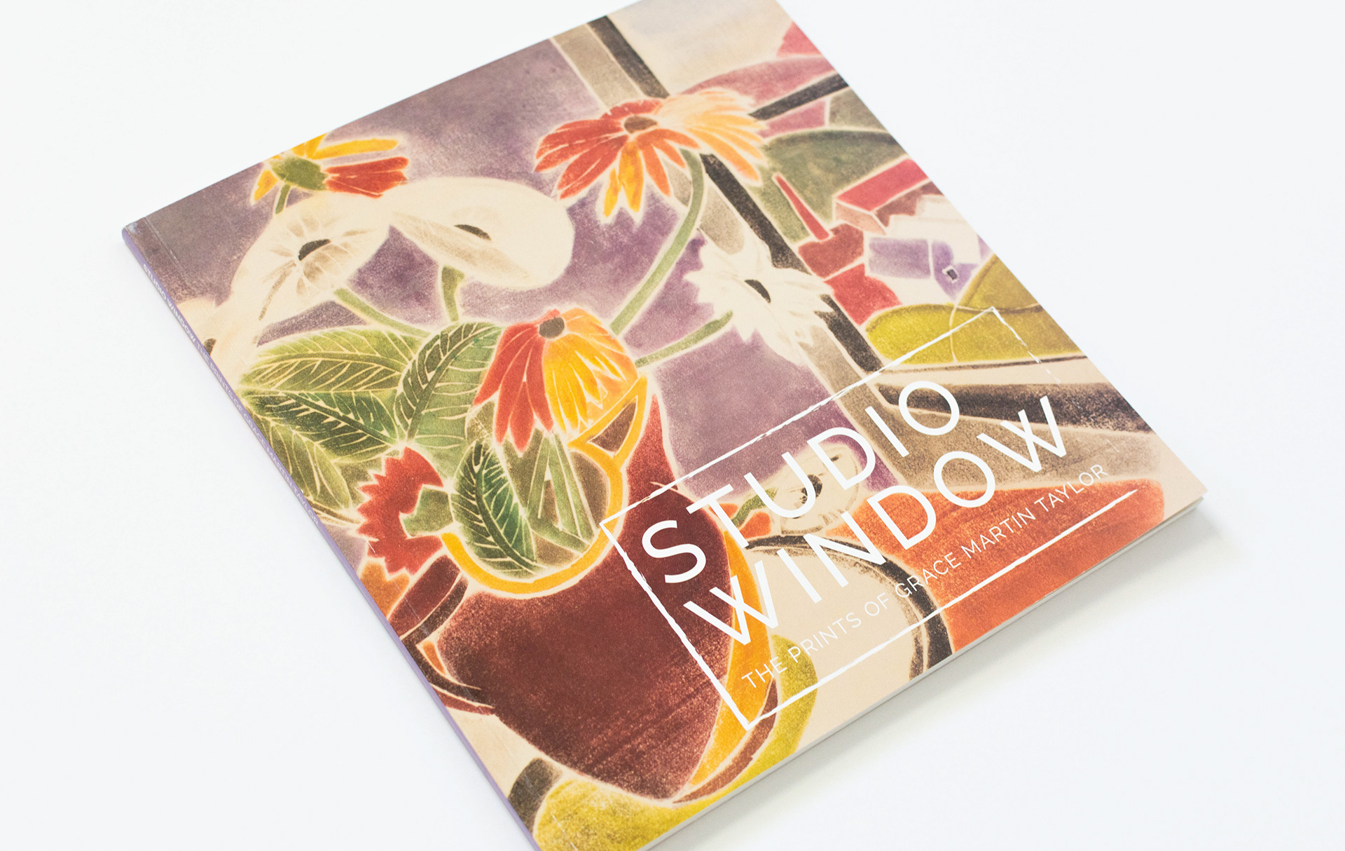 Publication cover featuring a full bleed block print.